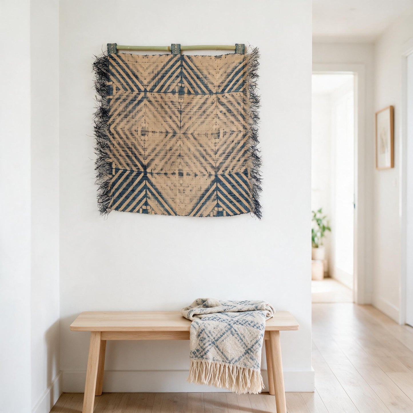 Denim blue raffia diamond wall hanging in a hallway