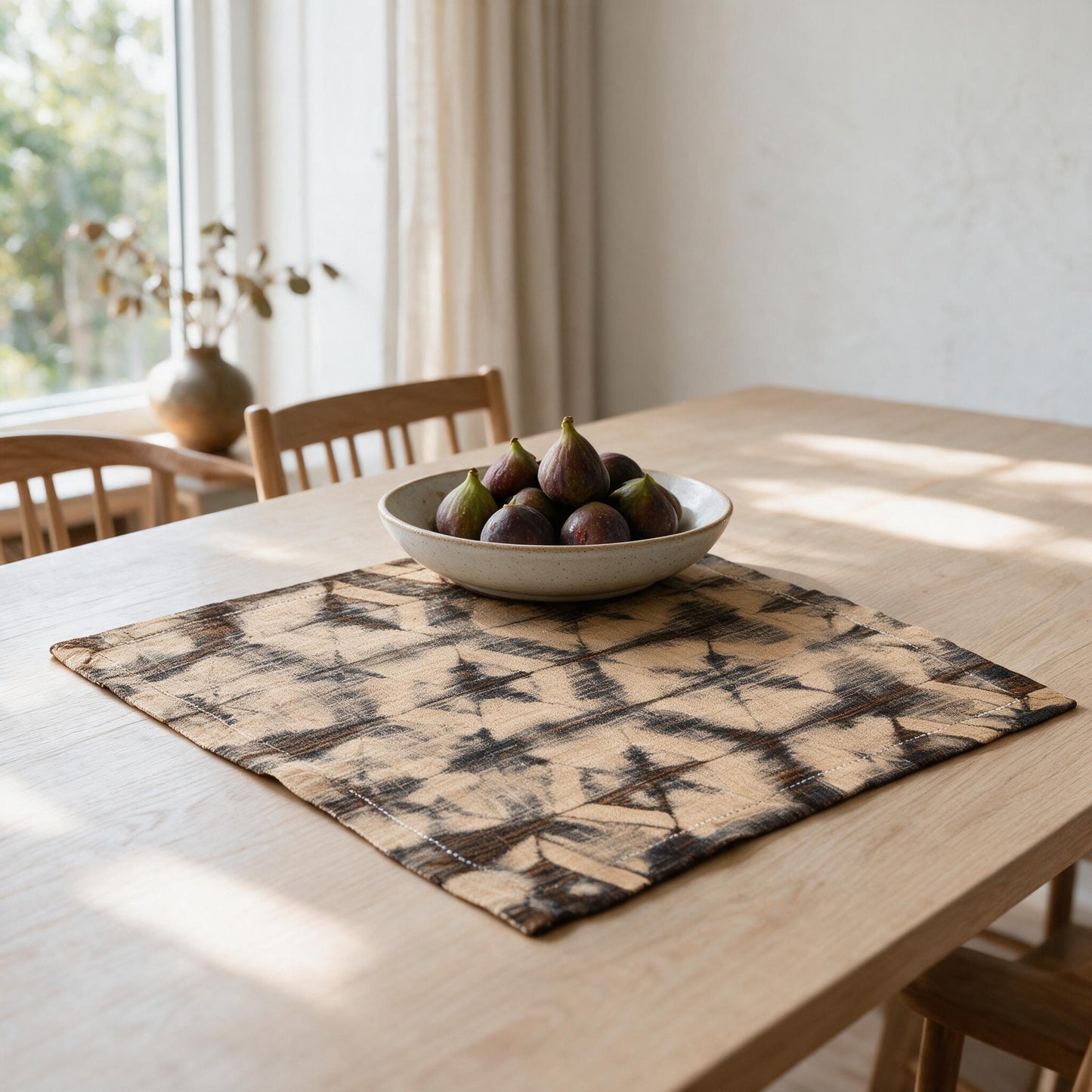 Brown and black raffia turtle-pattern centrepiece on a table