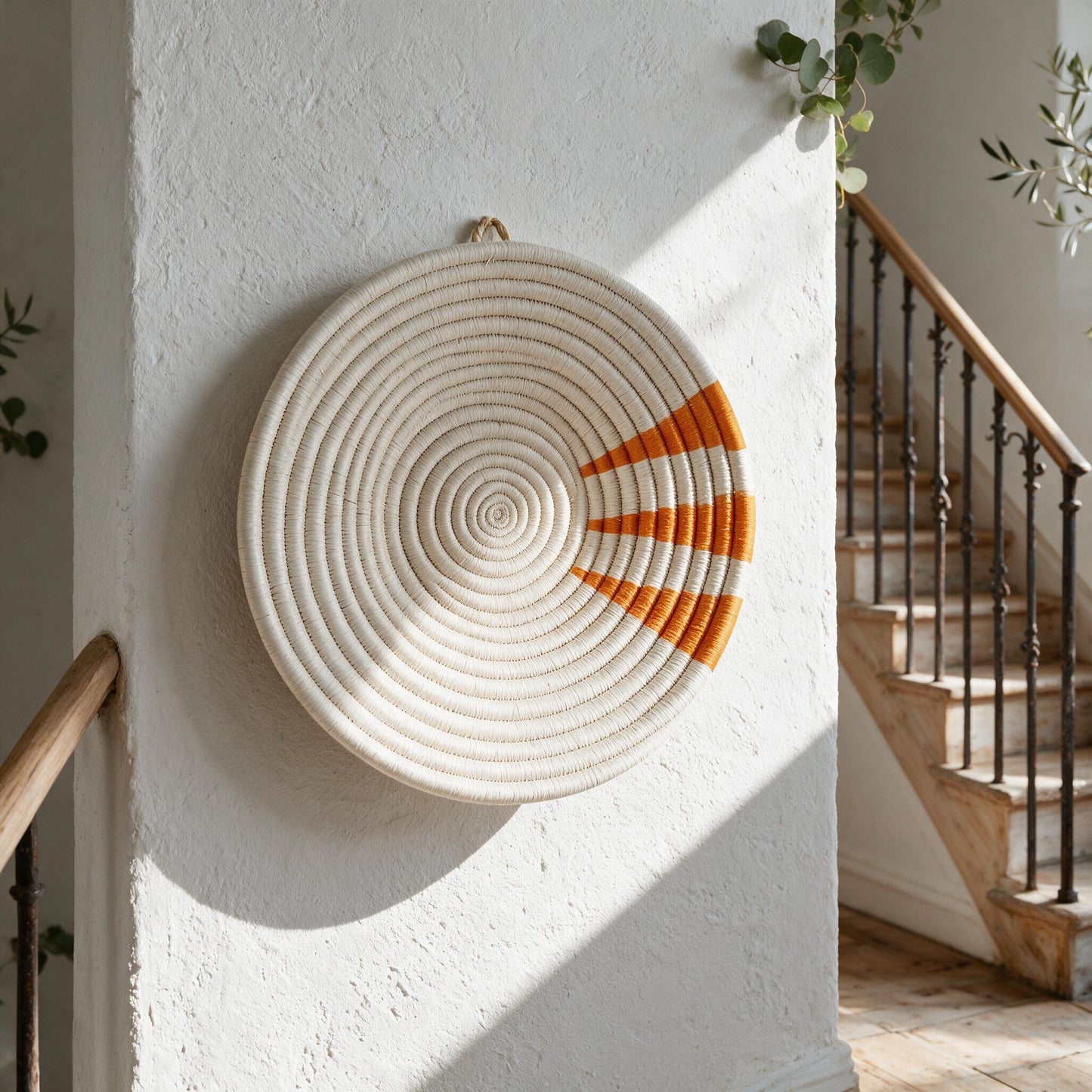 Moja orange wall basket on a staircase wall