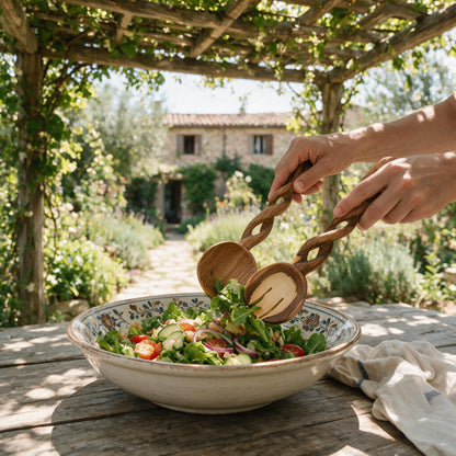 Olive wood spiral salad servers on an outdoor table