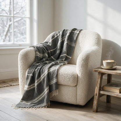 Aden cotton throw draped over an armchair